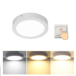 Round LED Tunable White Downlight. Hand on wall switch. Light with three color temperature